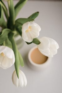 Bouquet of tulips near coffee